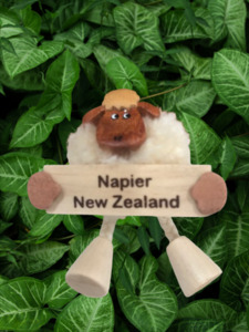 Products: Magnet - Pom Pom Sheep holding Napier, New Zealand sign