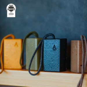 Products: Goats milk, wild kelp, pumice and activated charcoal exfoliating soap on a rope - Aermeda