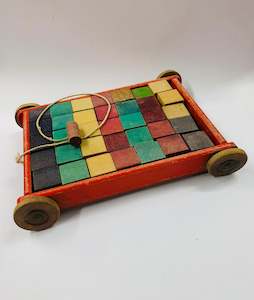 Vintage wooden toy trolley with wooden blocks