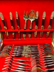 44 piece brass and teak wooden handled cutlery set