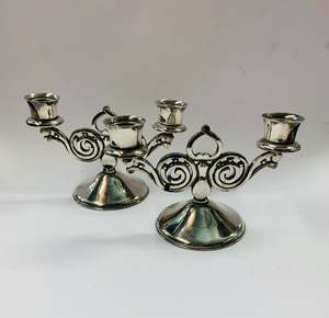 Pair of ornate silver plated candlesticks