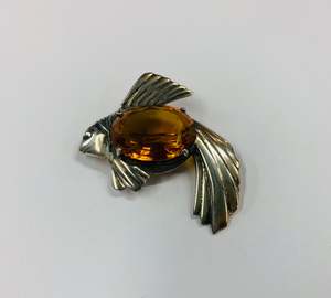 Large sterling silver fish brooch with orange stone