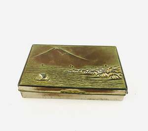 Metal Tin or a Sea Scape (maybe Rangitoto Island with a sail boat)