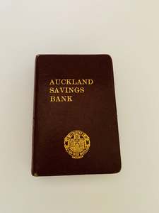 Kiwiana: Burgundy Auckland Savings bank money box