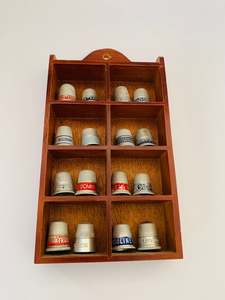 New Arrivals: Set of 16 metal Advertising thimbles in a wooden display case