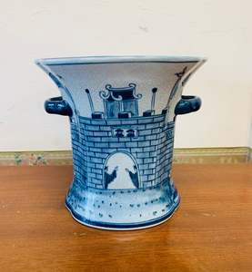Blue and white ceramic castle scene vase