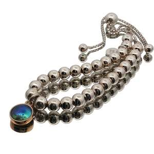 Elegant And Sophisticated: Two-Tone Paua Pearl Gold Moon Bracelet