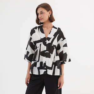 Tirelli: V Neck Peplum Top Black Abstract