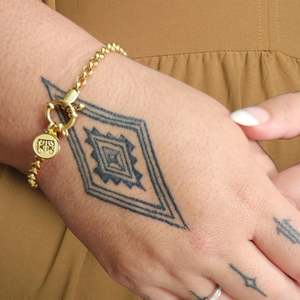 Earrings: Moko Kauae Bracelet (Gold) - Tahuri Made