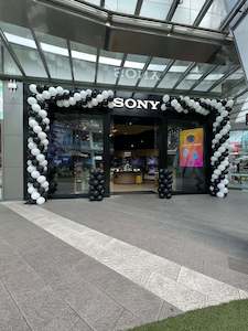 Corporate Balloon Packages: Custom Store Front Balloon Arch - Personalized qoute
