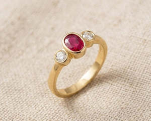 Rings 1: 18K Yellow Gold Oval Ruby & Diamond Trilogy Ring