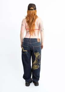 Gold metallic tiger embroidered skate jeans