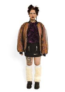 Faux fur coat encased in black mesh