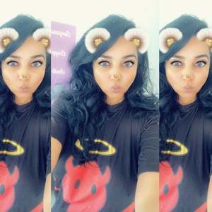 Nitu wears our Good AF / Bad AF - Oversized Bamboo T-Shirt at home in London, UK