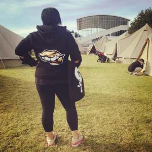 Kelly wears our Gold Lips Sequin hoodie at Womad, New Plymouth, NZ
