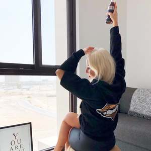 Sayitinbold: Kai wears our Gold Lips Sequin hoodie at home in Dubai