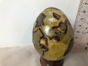 Serpentine carved egg 215g with wood stand - Phyllis Brown