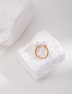 Pearl ring with an open design