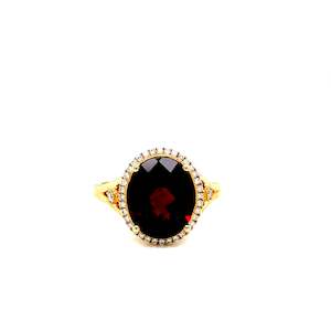 Coloured Stone Rings: Oval Garnet & Diamond ring