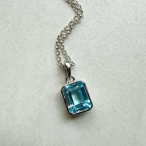 Sterling Silver Medium Emerald Cut Swiss Blue Topaz
