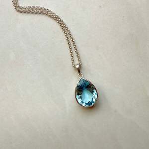 Products: Sterling Silver Blue Topaz Pear Cut Rubover Pendant