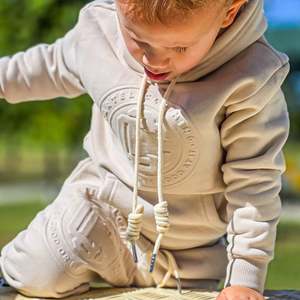 New Arrivals: Monogram Embossed Track Pants Kids - Stone