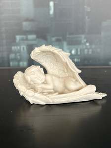 Cherub Lying in Wings