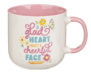 Gifts: A Glad Heart Makes a Cheerful Face Pink Ceramic Mug - Proverbs 15:13