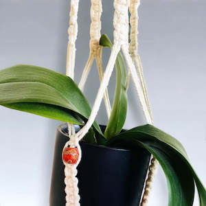 Macrame Plant Hangers: Painted Wood Bead Macrame Hanger.
