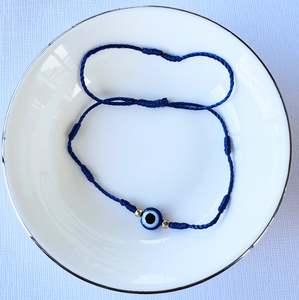 Bracelets: Evil Eye Seven Knot Bracelet.
