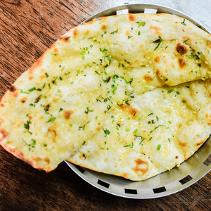 Products: Cheese Garlic Naan - Curry Guru Tweed Street