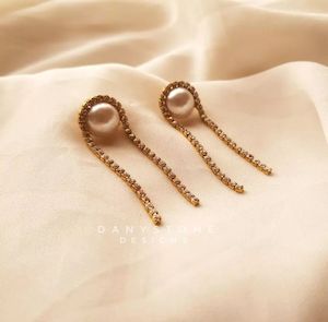 A Minimal Handcrafted Pearl Earrings Using Rhinestones