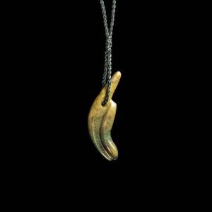 Craft: Jade Toki hand carved pendant by Nick and Mady
