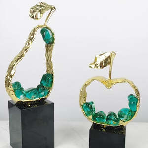 Interior Decor: Gold sculpted apple with purple gemstones