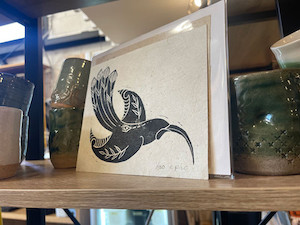 Products: Huia hand carved and stamped on harekeke paper A5 Epic Aotearoa