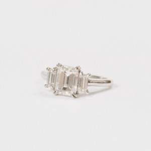 Wedding Rings: Moissanite Emerald and Baguette 3 Stone.