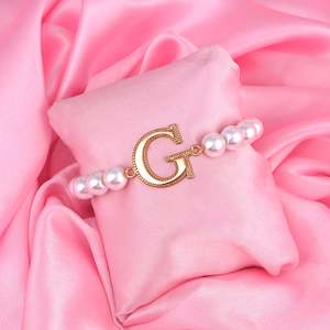 Bracelet: Estele Rose Gold Plated Glowing "G" Letter Glass Pearl Bracelet for Women