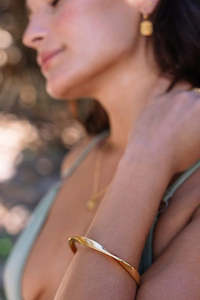 Gifts Under 200: Lotus Twist 18k Gold Plate S/M Solid Bangle