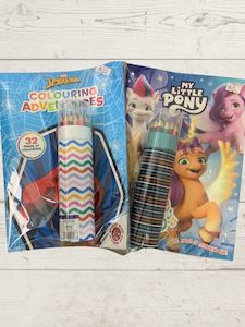 Books And Colouring: Children's colouring book with pencils.