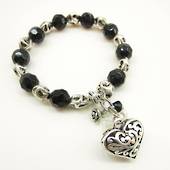 Products: Black and clear bead with koru heart bracelet