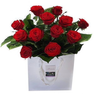 Valentine's Day: Red Roses In Craft Paper Bag