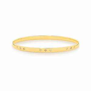 Bracelets And Bangles: 9ct y/g half round bangle with inner set 3x pink tourmaline and 6x dia