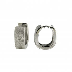 Sterling silver rhodim plated huggie earrings with ice matt sparkle finish.