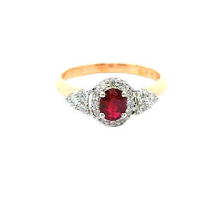 Engagement Rings: Oval Ruby and Diamond trilogy style ring