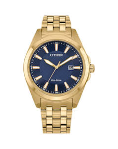 Gold plated stainless steel Eco-Drive with a blue dial, batons & date.