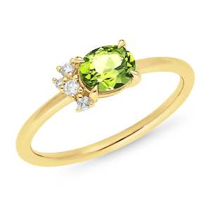 Peridot Collection: Oval Peridot and Diamond set Dress Ring