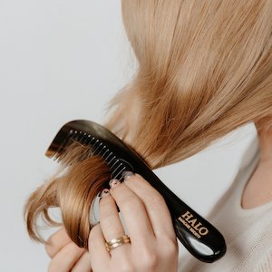 By Brushes: Partner in  Style - Horn Pin Long Handled wide tooth Comb.