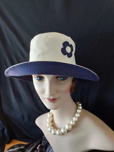 Products: R265: Cream and navy linen hat with a lovely contrasting flower (sewn on) detaill Hokianga Hats