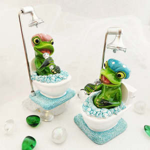 Woodland Grotto: Frog Singing n. the Shower Loo (pink or blue cap. approx. 15x8.5cm)