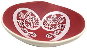 white aroha fern on red